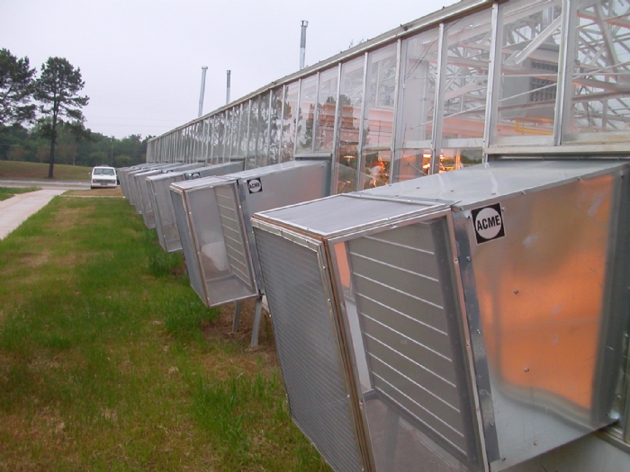 a shot of Acme Fans with the Equipment Screen Cages installed at a greenhouse