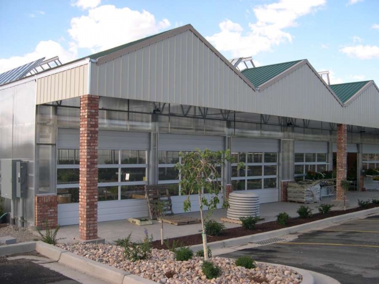 a view from the outside of the Olson's Nursery and Gift using the Dual Atrium and Specialty Structures greenhouses from Prospiant