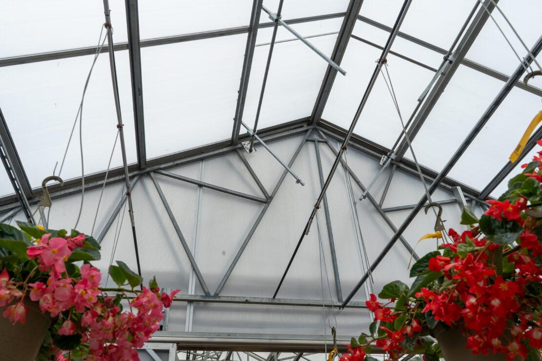 Rack-and-pinion systems make it easy to open greenhouse vents for ventilation.
