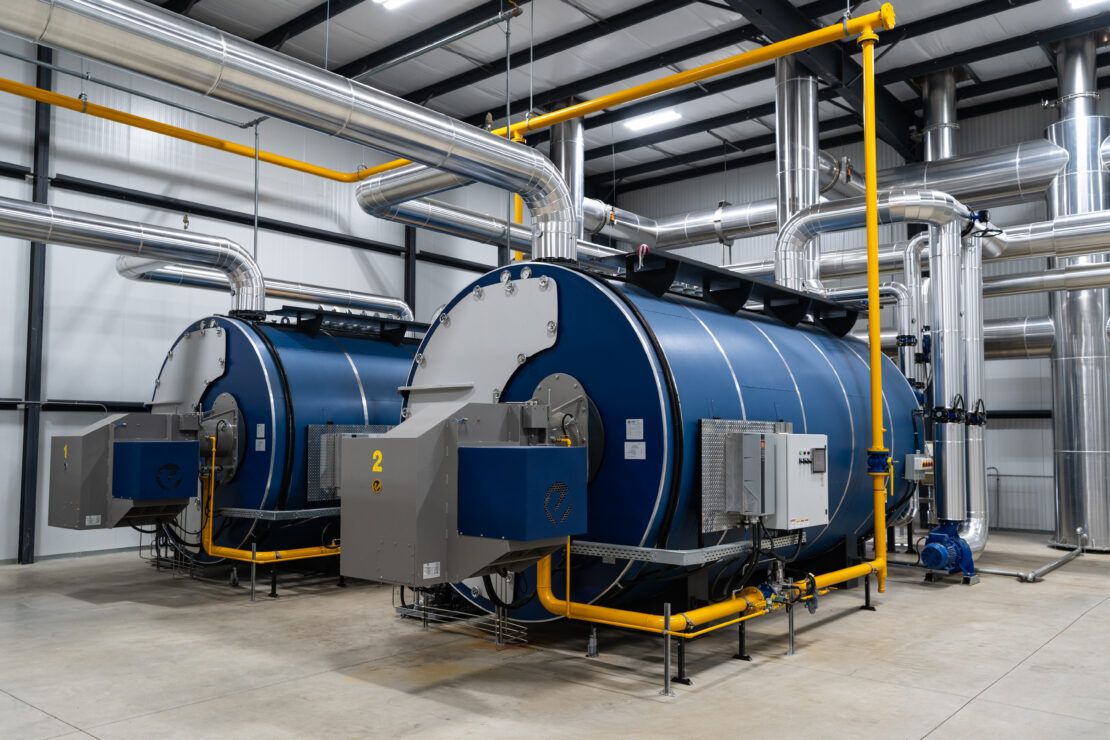 High-efficiency, ASME-certified 3-pass boilers and CO₂ condensers produce hot water for temperature control.